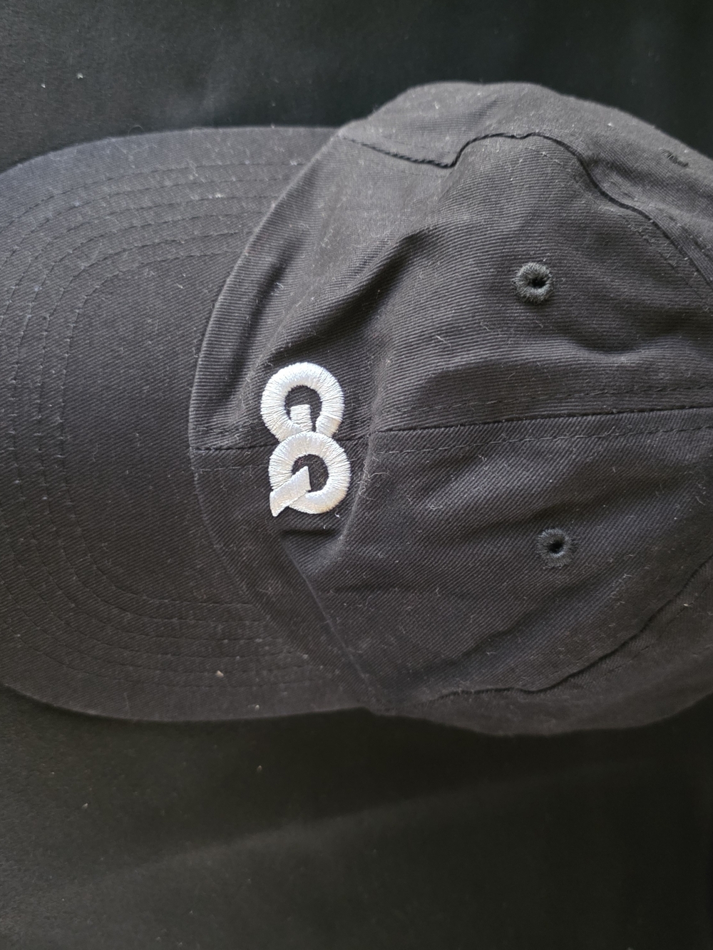 Black Cap with White Interlocking 'GQ' Embroidery